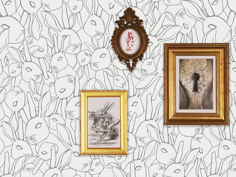 WOW Enchanted wallpaper inspired by Alice in Wonderland by Muraspec features drawings of rabbit heads