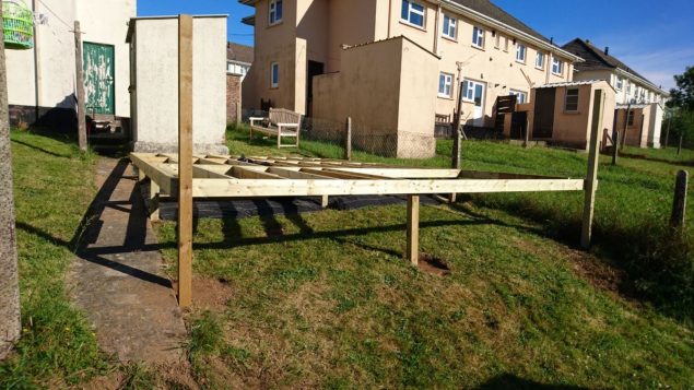 Garden makeover showing frame structure for the raised decking under construction