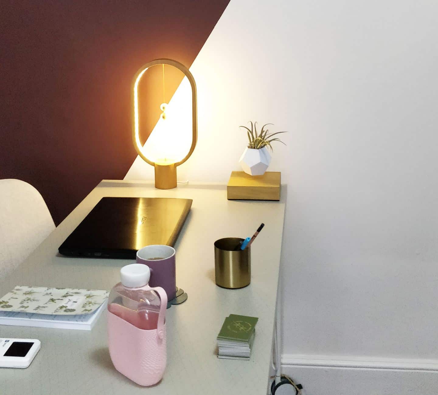 Heng Balance Lamp by Enso & Paris on a desk in an office