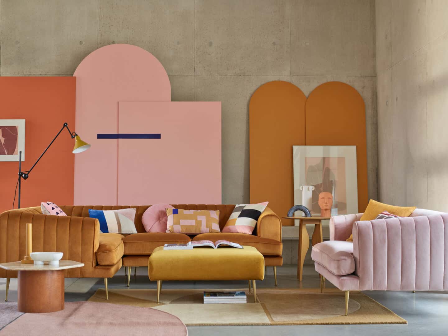 Autumnal Hues in interiors - Living room setup featuring a cinnamon velvet corner sofa from DFS, a pink chait and a mustard yellow foot stool.