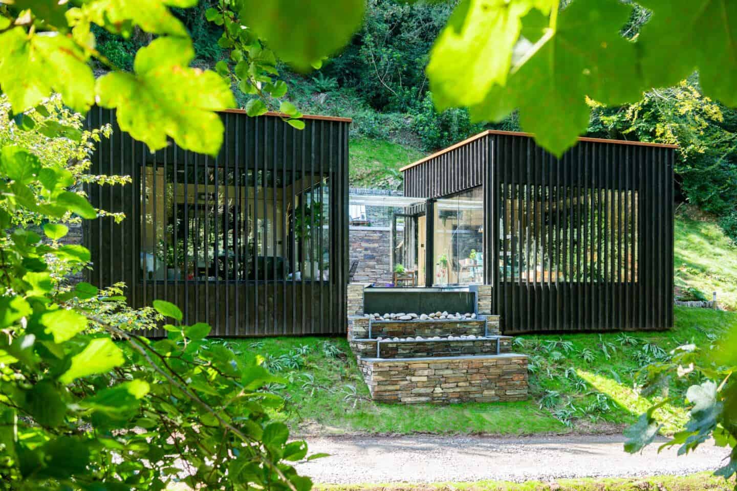 Wildwood Spa in the forest of North Devon is clad in black timber that has been treated using the Japanese technique of Shou Sugi Ban