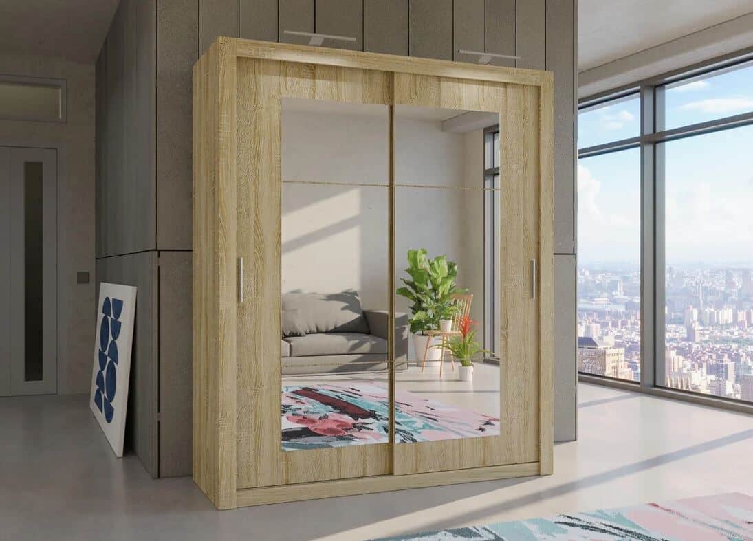 Large double wardrobe with mirrored sliding doors in a modern room in a high-rise apartment block. City views can be seen out of the window.