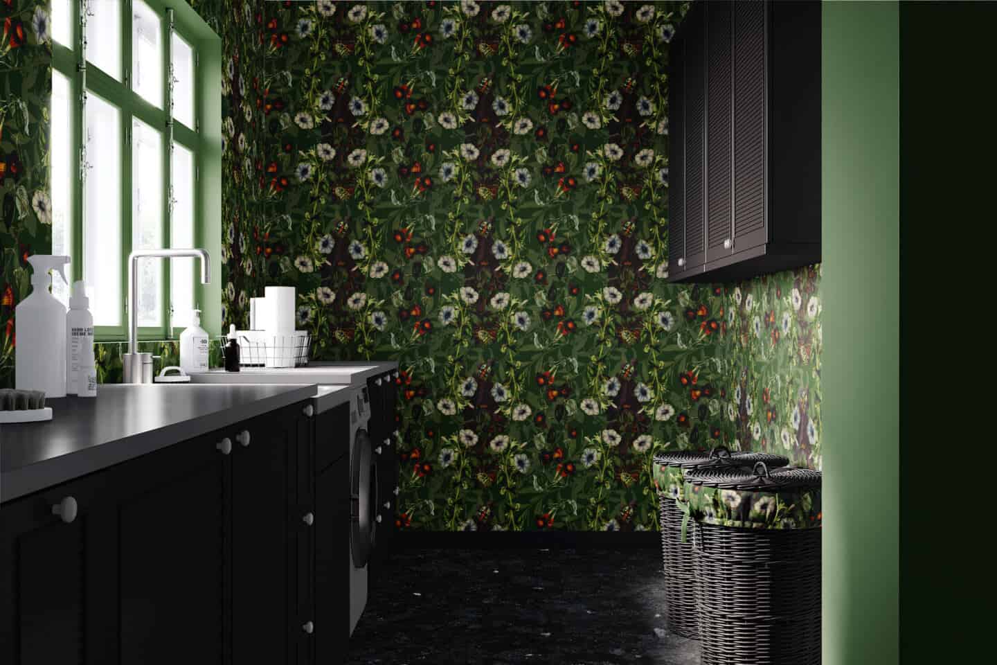 A utility room with black cabinetry and green floral wallpaper featuring bugs and butterflies.