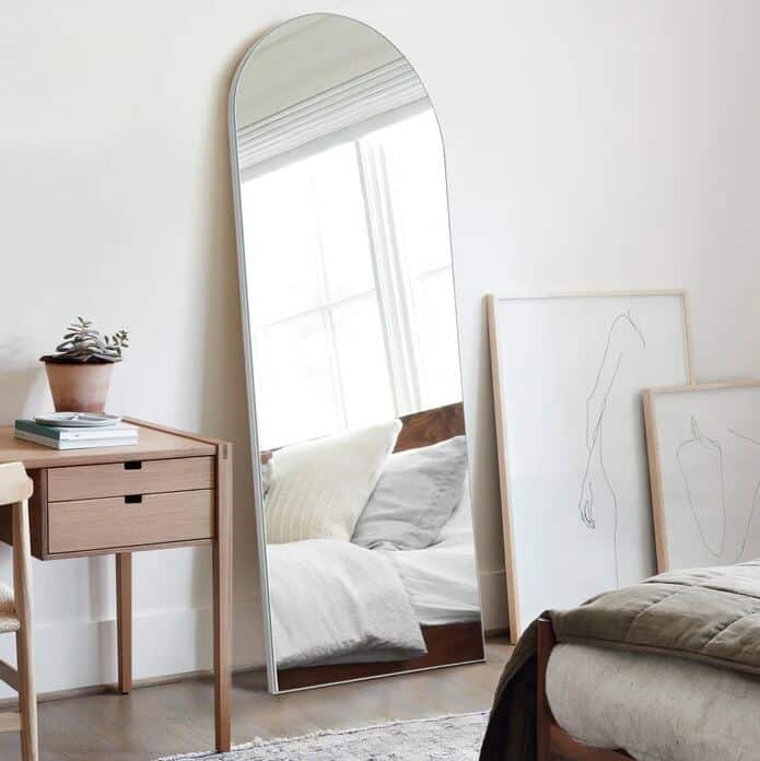 An free-standing arched mirror from Neutypechic in a Scandi-style bedroom
