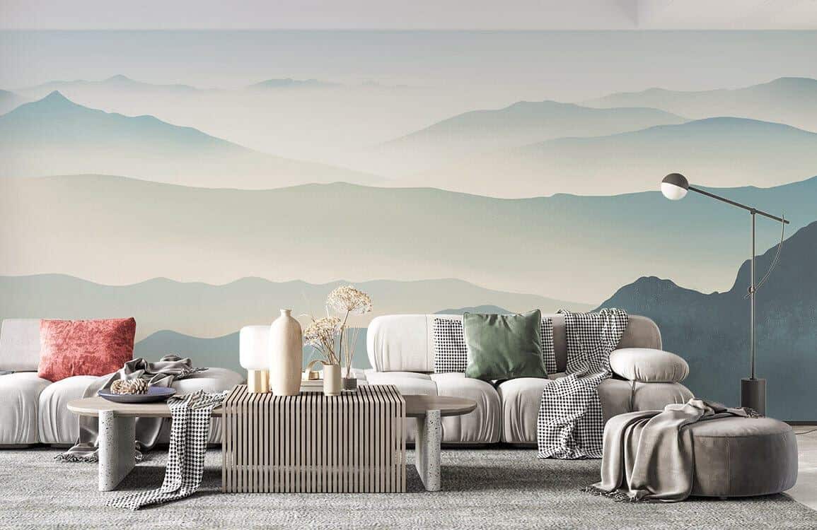 Fototapete mit Bergen hinter einem minimalistischen grauen Sofa und einem Couchtisch aus Stein