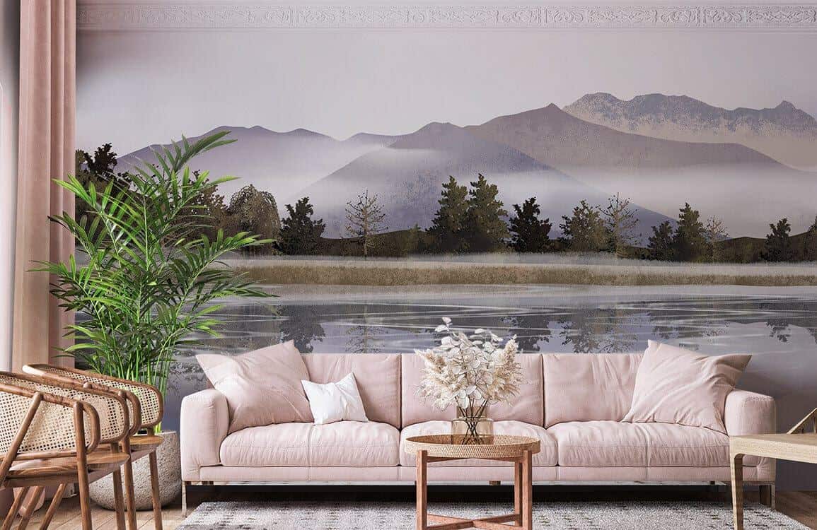 Eine Fototapete mit Bergen und einem Gewässer von Ever Wallpaper hinter einem modernen cremefarbenen Sofa und einem kleinen runden Couchtisch aus Rattan