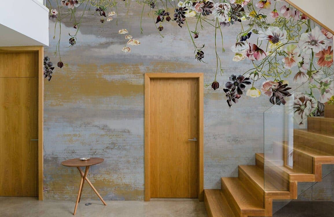 Floral wall mural from Ever Wallpaper in a hallway going up the stairs