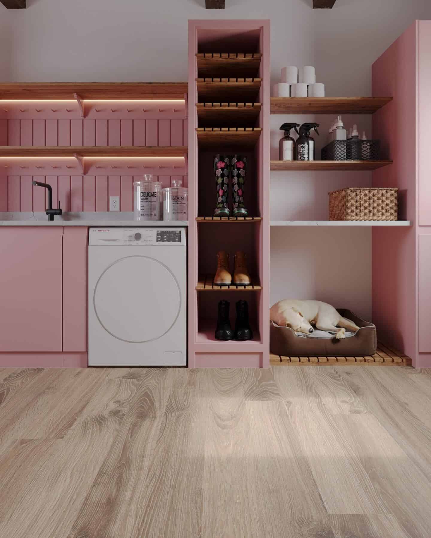Oak effect laminate flooring in a pink utility room 