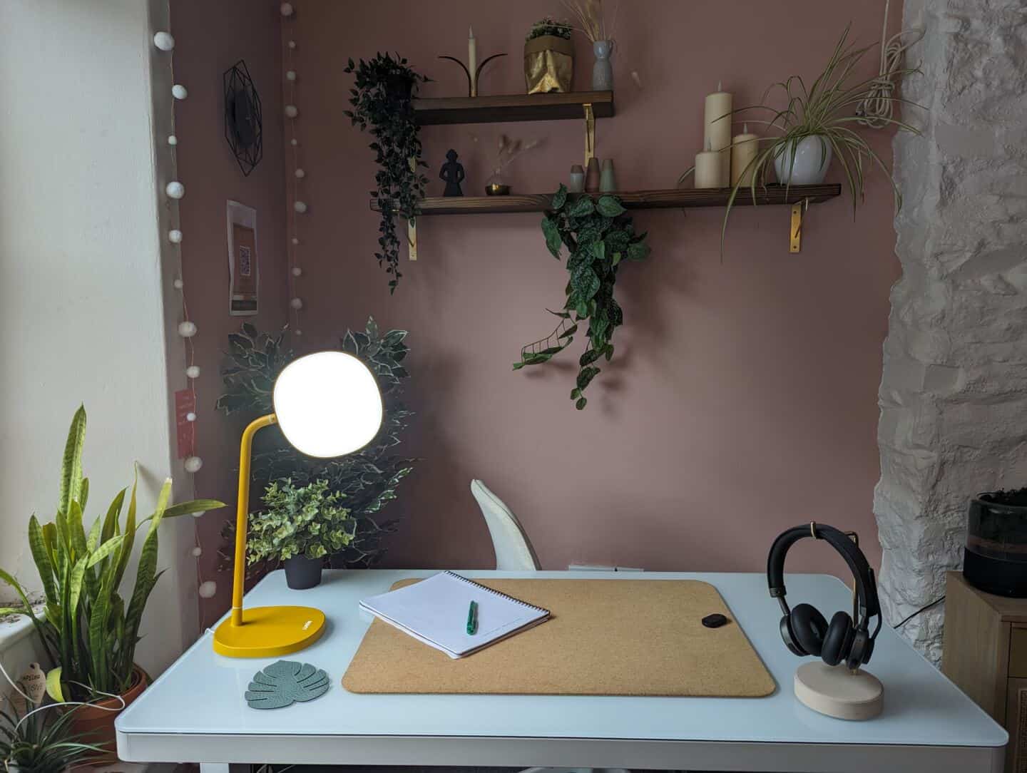 The Lumie task lamp on a white desk in a pink office
